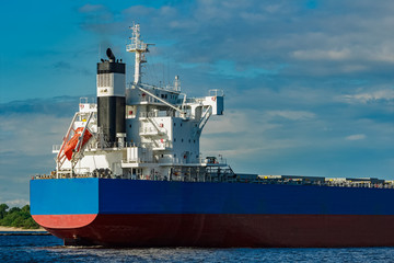 Blue cargo ship underway