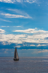 Blue sailboat at journey