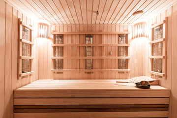 Interior of new Finnish sauna, infrared panels for medical procedures, classic wooden sauna.