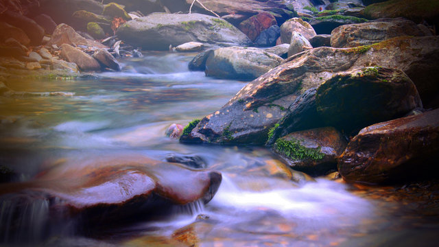 Magical Fantasy Sunlight Colorful Shinning over a Creek or River in the Smoky Mountains
