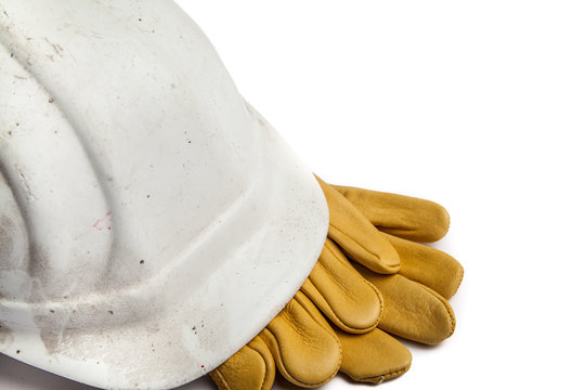 Construction Workers Hard Hat and Gloves on white background with copy space