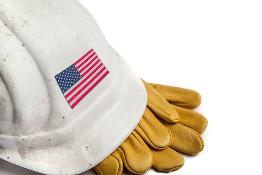 Construction Workers Hard Hat and Gloves showing badge of the  flag of the USA