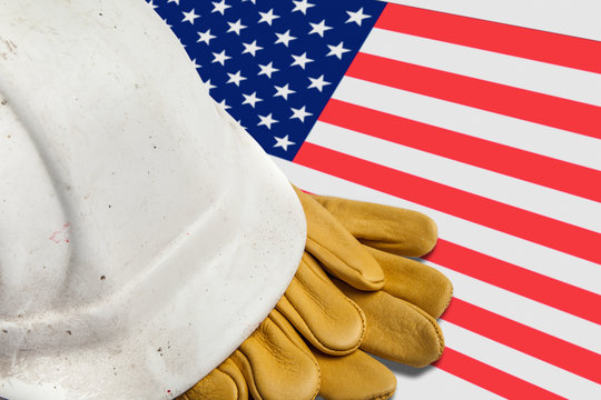 Construction Workers Hard Hat and Gloves on flag of USA