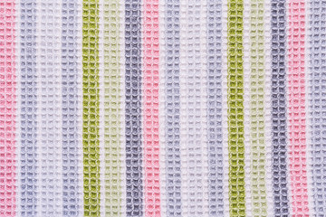 texture of a fabric surface consisting of multicolored vertical stripes, abstract background