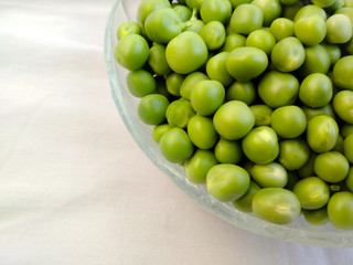 Fresh organic green pea in a bowl