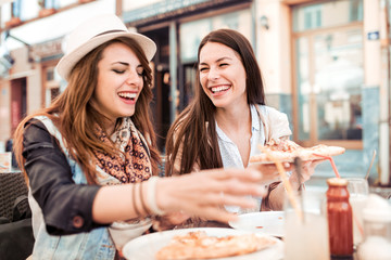Young woman with friend having lunch