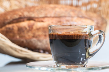 transparent hot coffee cup and bread in white blackground