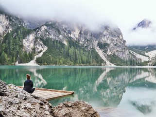 Fototapeta na wymiar Person meditating on a lake