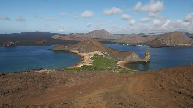 slow zoom in shot pinnacle rock and isla bartolome in the galapagos islands, ecuador