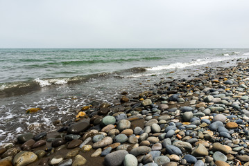 Sea coast, pebbles on shore