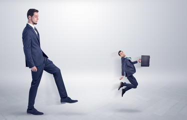 Small man fired by boss with white wallpaper