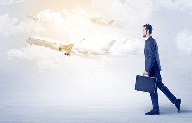Obraz premium Businessman going somewhere with airplane