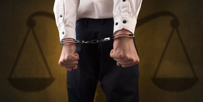 Arrested man with balance on the background