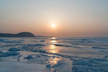 Sunset above iced sea