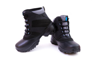 Black winter shoes. 
Pair of black winter shoes isolated on white background
