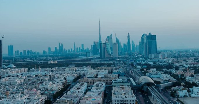 DUBAI, UAE &ndash; MARCH 2016 : Holy grail timelapse of Downtown skyline at sunset with day to night transition