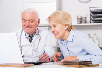 Male doctor with female client