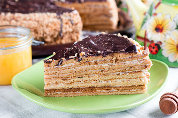 Sweet home layered honey cake on a wooden table