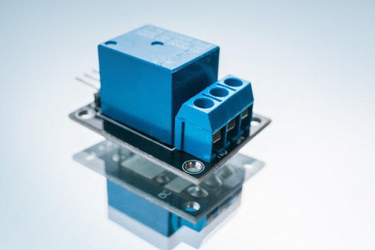 electronic relay on a white background. device for closing and opening an electrical circuit. microelectronics science.