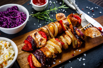 Kebabs - grilled meat and vegetables on white background