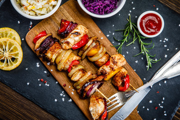 Kebabs - grilled meat and vegetables on white background