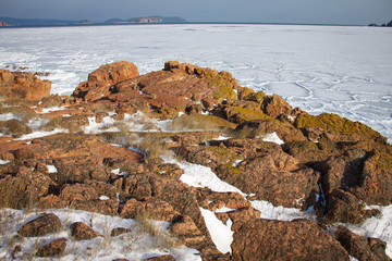 Winter landscape. Sea view covered with ice.