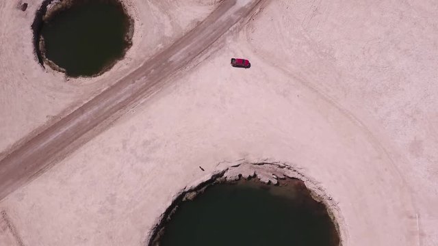 Aerial view of the eyes of the salt flats, Chile. Tourists walking around the site, 4k