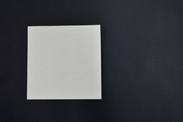 White paper on black background.