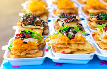 Kind of Indian food made of flour sprinkled with colorful.