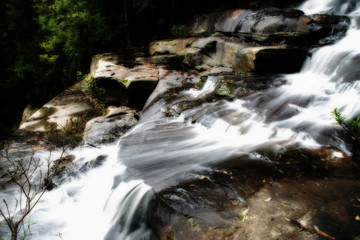 Fototapeta na wymiar White waterfall in the forest.