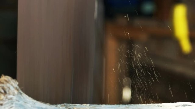 close up of a saw blade cutting a log at a huon pine mill in tasmania, australia