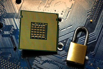 CPU Computer Processor over motherboard and padlock. Security Concept.