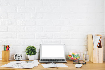 Fototapeta na wymiar Creative designer workplace with blank laptop