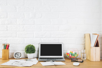 Fototapeta premium Creative designer workspace with blank laptop