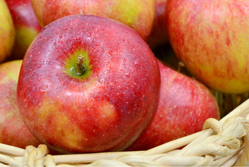 many apples  in wooden basket