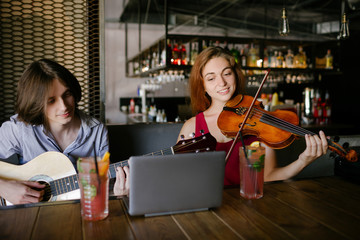 young people learn to play musical instruments and exchage skills. help support education self-improvement concept