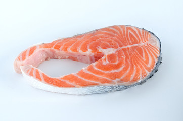 Slice of salmon on white background.