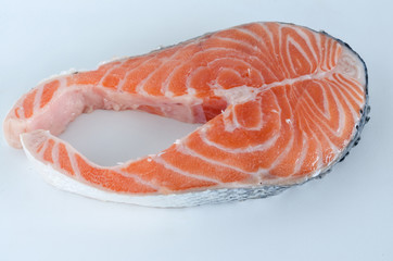 Slice of salmon on white background.
