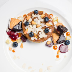 dessert pastries and confectionery assortment on white background. delicious restaurant food. overeating problems.