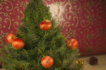 Christmas tree with toys on a red background.