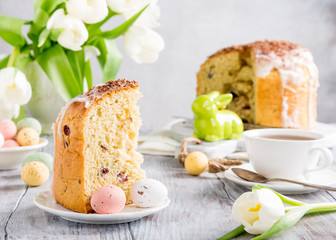 Slice of easter orthodox sweet bread, kulich end quail eggs. Holidays breakfast concept.