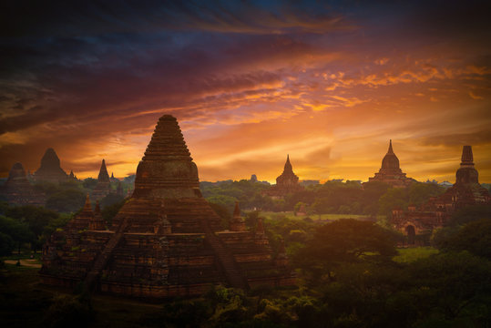 Landscape image of Ancient pagoda at sunset in Bagan, Myanmar.