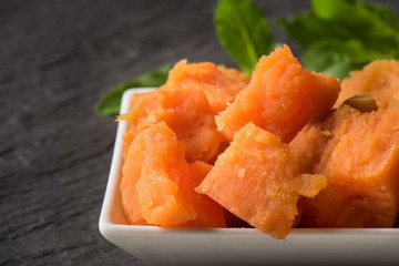 Close-up sweet potatoes in container for serve,  Anthocyanin food for healthy eating and healthy lifestyle, Nutrient potatoes food and high antioxidant