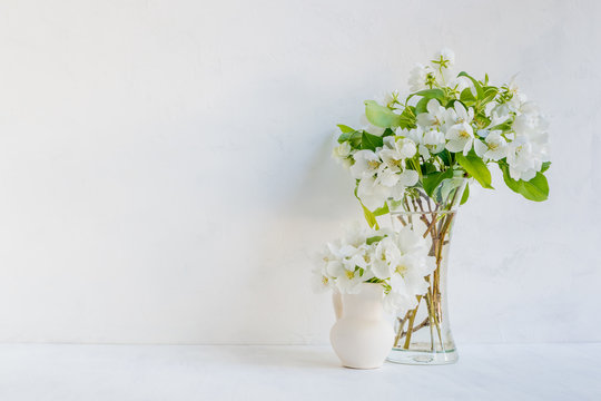 White flowers in a vase on a light background