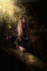Beautiful woman  in dark forest.
