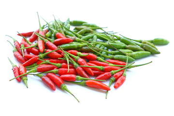 Group of green and red chillies on white background