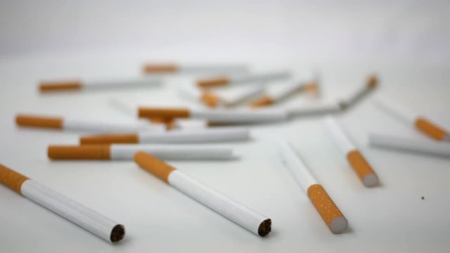 Spinning generic cigarettes spinning over white ALT Version