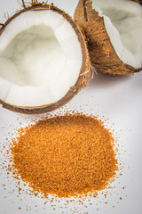 Coconut with coconut sugar isolated on white background.