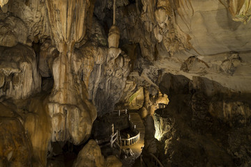 Cave with concrete foot path and light in Laos, Asia
