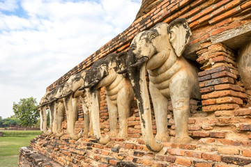 Fototapeta premium Pagoda with Old Elephants Statue Base in world heritage site Sukhothai historical park